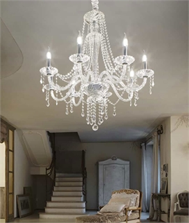 Crystal Elegance: 8-Arm Chandelier with Chrome Detailing and Sparkling Droplets